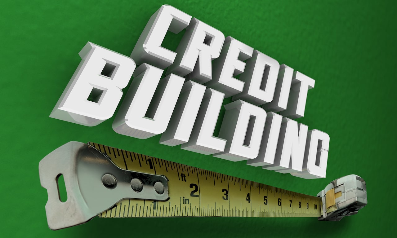 Green background with credit building. credit building challenges